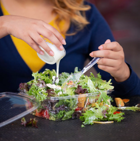 Overflowing Take-Out Salad Containers